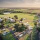 Aerial drone view showing the campground layout, RVs, roads, pavilion and nearby water — matches 'Nearby Attractions' / gallery imagery on the property's site and provides a useful overall overview.
