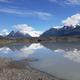 Another lakeshore/glacier view showing shoreline and reflections; supports scenic character of the property (page context notes ‘PERFECT Conditions!’).