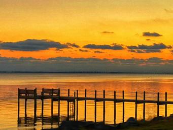 Fishing pier at sunset at Coastline RV Resort