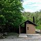 Vault toilet near entrance of campground