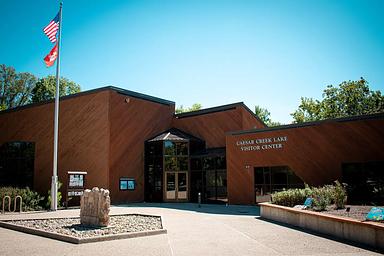 Visitor Center with flag and blue skies