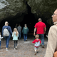 Shows the cave entrance with visitors approaching — useful to illustrate on-site cave tours (source: homepage image context 'Host Your Next Event Here!').