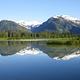 Shakes Slough 1 Cabin view showing snowcapped mountains reflected in water