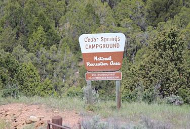 Cedar Springs Campground sign at the entrance of the campground.