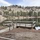 Wooden fishing pier on a lake.