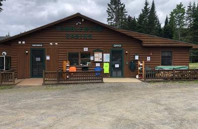 Log cabin office with outdoor merchandise display