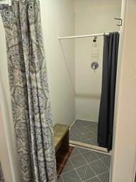 Interior photo of a shower stall in the restroom facilities — documents campground amenities and is suitable for the facilities section of the gallery.