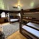 Historic forest service cabin bedroom with bunk beds.