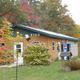 Building marked 'VIEW' (service/office or amenity building) set in campground with trees — documents on-site facilities and appearance (gallery image).