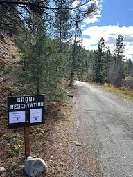 Group reservation sign posted at entrance to campground 