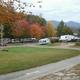 Fall-season wide vantage showing many RVs, road curves and mountain backdrop — good seasonal/overview shot of the campground layout (source: Big Rig Sites page).
