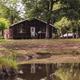 view of clubhouse from pond