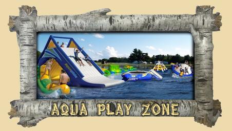 Framed image labeled 'AQUA PLAY ZONE' showing inflatable water play features on a pond — represents the campground's water play attraction shown in the site's gallery.