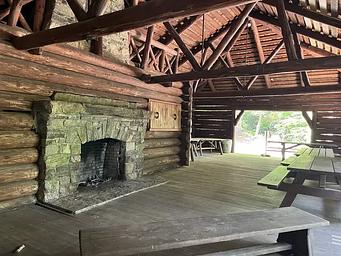 A photo of facility CAVE MOUNTAIN LAKE GROUP PICNIC SHELTER with Picnic Table, Fire Pit, Shade