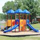 Colorful children’s playground equipment (slides, rubber mulch area) located on manicured lawn — illustrates family-friendly playground amenity on the property listing.