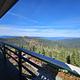 View from the Lookout with trees and hills and blue sky.