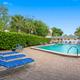 Outdoor swimming pool and deck with lounge chairs — shows on-site recreational facilities. Labeled Pool on the gallery page.