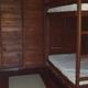 Interior photo showing bunk beds inside a cabin — useful to illustrate cabin interior accommodations (from the rustic cabins page).