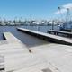 View of boat ramps and multiple commercial fishing boats at the marina docks — illustrates marina slip/launch facilities listed on the site.