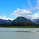 View from Shakes Slough 1 Cabin showing snow capped mountains and water