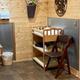 Interior amenities photo of a clean, wood-trimmed restroom/laundry or utility area — shows on-site guest facilities (Amenities page).