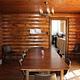 Redfeather Ranger Cabin dining room showing table with eight chairs, and chandelier.
