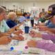 Interior community center scene (bingo) showing activities and indoor facilities available to residents/guests.