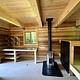 Inside of cabin showing oil stove, shelf, bunkbed