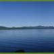Panoramic lake vista with calm water and distant shorelines — illustrates the preserve’s lakefront scenery (from Contact Us / site imagery).