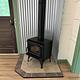 A new wood stove installed near the front door.