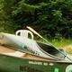 Foreground canoes and paddles with a visible 'Troll Landing' sign and tent in background — shows canoe/kayak equipment and river-access campsite, consistent with property canoe livery and site imagery.