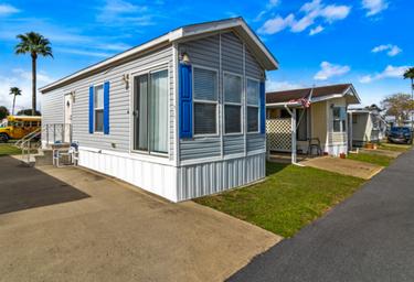 Row of park model/mobile home units and paved drives — useful image of the resort's lodging/annual sites, matching visuals on the Lakewood RV Resort page.