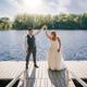 Couple on a dock overlooking the river — from the weddings/events gallery but also shows the resort dock and riverfront decking, a useful scenic shot of the property’s shoreline amenities.