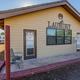 Exterior photograph of the park laundry building with surrounding RV spaces visible — shows on-site guest amenities (gallery page).