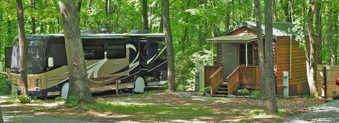 Shady RV Site near a Cabin