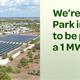 Aerial view showing the campground layout with a large on-site solar farm and adjacent RV sites; image appears on the resort homepage promoting their 1MW solar installation (supports property relevance).