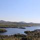 The Wichita Mountains line the horizon beyond the shore of Quanah Parker Lake.