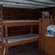 Inside view of the cabin with bunkbed and cabinet storage
