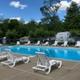 Swimming pool with lounge chairs and fenced area — clear depiction of the resort’s pool amenity; image is on the property page.