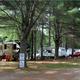 Shaded RV/trailer sites among trees with site signage visible — shows typical RV pitch layout at the campground (used on the site under Camden Hills Campground). Good campsite facility view.