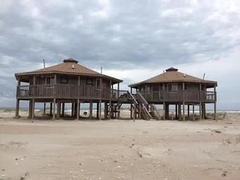 Long Point Cabins 5,6,7 and 8 under a cloudy sky