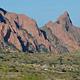 Chisos Basic Campground Area from a distance surrounded by mountain peaks