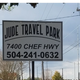Entrance sign for ‘Jude Travel Park’ with address and phone — clear on-site identifier likely from the park’s homepage (page_url judetravelpark.com). Useful as a property image.