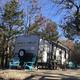 Level gravel RV site with full hook-ups at Branson Shenanigans RV Park