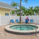 Hot tub/spa area with seating and fencing — complements pool photo and shows additional amenities. Matches gallery Hot Tub / pool deck image.