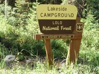 Lakeside Campground Entrance Sign- it is Cream and Brown in Color with a Forest Service Shield