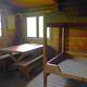 Sergief Island Cabin interior showing wood bunkbed and table