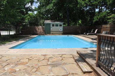 On-site swimming pool with deck and seating — useful facility photo showing guest amenities and layout (from the gallery page).