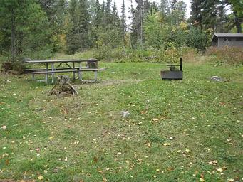 Picture of picnic table and fire ring.
