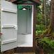 Gut Island 2 Outhouse with door held open 